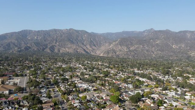 Aerial view above Pasadena neighborhood with mountain in the background. northeast of downtown Los Angeles, California, USA