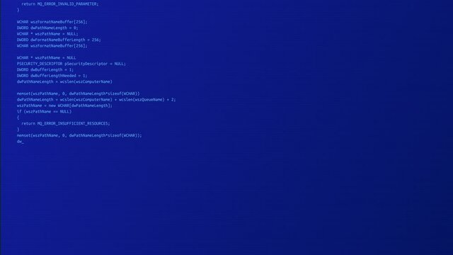 Programming code running down on computer screen Loop Animation. Program Code on a Computer Screen in Defocus. Software development and hacking concept. Technology, coding, programming
