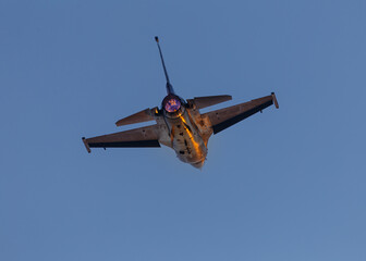 Fototapeta na wymiar Closeup of fighter jet overhead, afterburners on