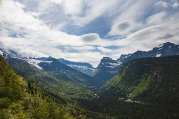 Fototapeta na wymiar Snow covered mountain tops in Glacier National Park, Montana