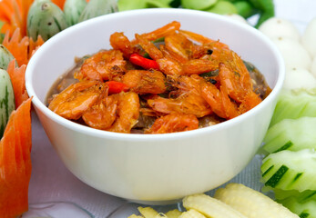 Chilli paste top of shrimp and mix vegetables.