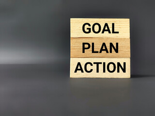 Inspirational and motivational concept - GOAL PLAN ACTION text on wooden blocks background. Stock photo.