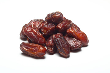 Dates on a white background. Dried fruits. Dried dates lie next to each other	
