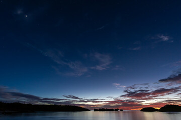 Beautiful and peaceful long exposure scene taken at the blue hour on Hoshizuna beach, calm sea, ...