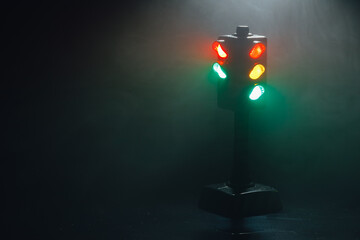 traffic lights at night in dense fog