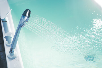 shower filling a bathtub with water stream