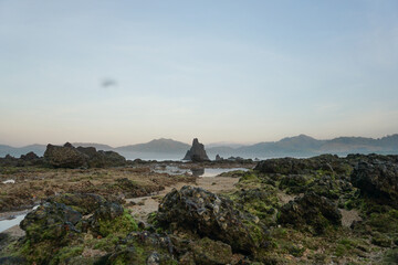 Fototapeta premium Beautiful morning with clear sky at Pulau Merah beach in Banyuwangi Indonesia.