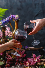 Still life in old masters style with fish, glass of wine, old dishes, fruits. The concept of a richly decorated table.