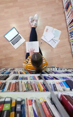 the student uses a notebook and a school library