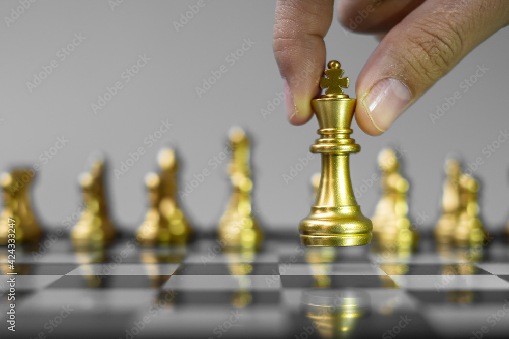 Wall mural gold Chess king figure Stand out from the crowd on Chessboard background. Strategy, leadership, business, teamwork, different, Unique and Human resource management concept