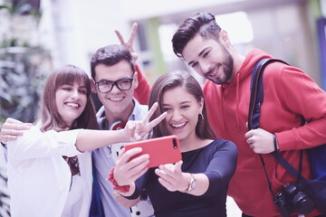 Group of multiethnic teenagers taking a selfie in school
