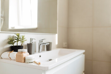 Fototapeta na wymiar Washbasin in bathroom, bath accessories. Household, hotel cleaning concept