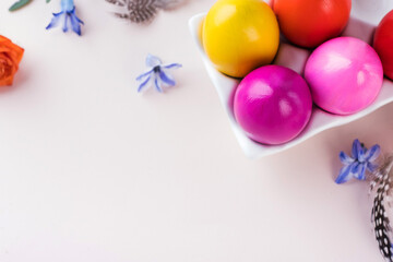  Colorful Easter eggs on a pink background. Bright Easter concept. Copy space.