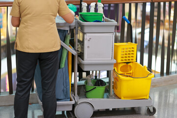 Fototapeta premium The cleaning staff car in the mall cleans the floor and a lot of cleaning supplies in it.