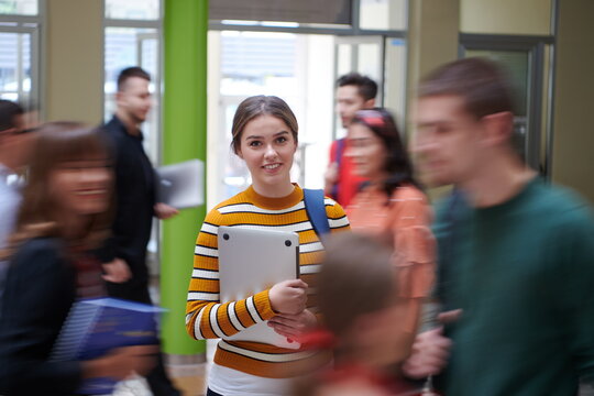 famel student with modern technology in school