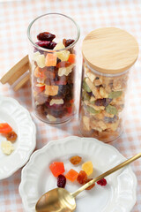 At breakfast, set a small white plate of dried fruits such as papaya, mango, cranberries and raisins.