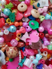 Fototapeta na wymiar Multi-colored beads for handicraft masters