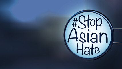English texts “#Stop Asian Hate” on label in front of shop at night, concept for calling international community to stop hurting and hating Asian people.