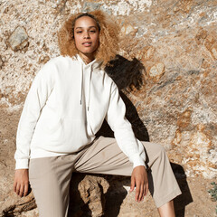 Beautiful woman in white hoodie winter fashion