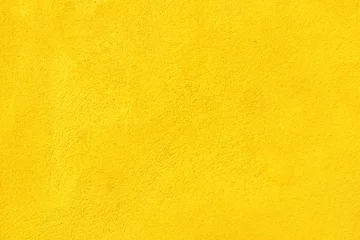 Deurstickers Yellow concrete wall texture background. © Paitoon