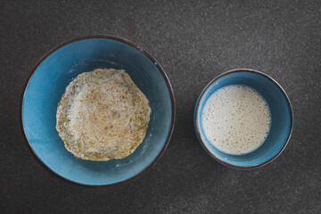 dry and wet mix in bowls ready to bake vegan savoury muffins with nutritional yeast and dairy-free miilk, healthy plant-based food