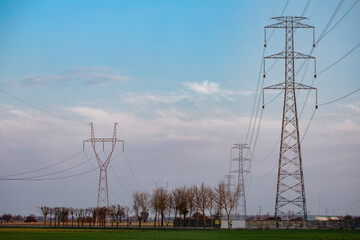 Pylon with insulatros and lines, wires. High voltage transmission line.