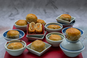 A traditional asian pastry or Tao Sor on marble table. Chinese sweet pastry filled with mung bean paste, taro, and salted egg, One of popular snack in Phuket Thailand originated from China, selective 