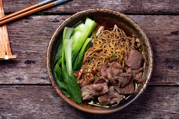 Egg Noodle Noodles with Stewed Pork and Vegetables on Wooden Floor Thai Food