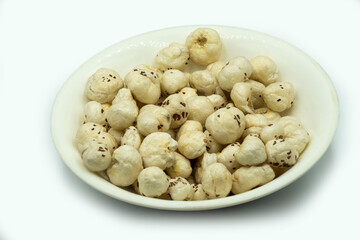 Mumbai , India - 15 March 2021, Euryale ferox commonly known as prickly waterlily or Gorgon Plant or Prickly water lily or Makhana served in a bowl at Mumbai Maharashtra India