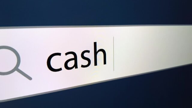Cash back written in search bar with cursor ,a computer monitor, close-up with the effect of a camera zoom