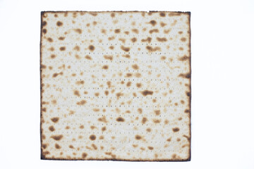 Whole wheat Matzo flat bread isolated on white background