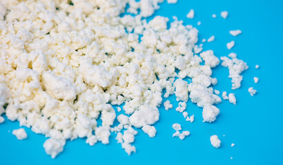 Milk curd on a blue background.