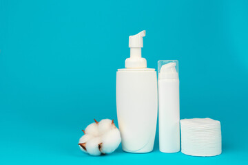 Stack of cotton discs and skicare cosmetic bottle