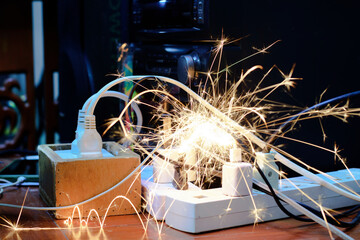 Short circuit, causing a spark to the plug. Using a non-standard power plug Old appliances,...