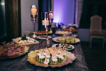 A table topped with plates of food