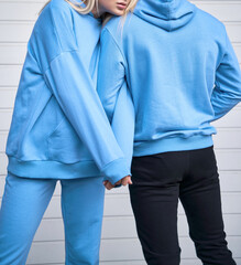 pair of woman and man wear a no logo hoodie. sweatshirt design template. copy space street wear clothing