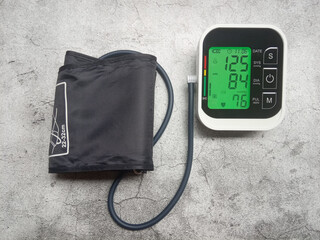 Flat Lay Photo, Digital Tensimeter or Blood Pressure Meter, with normal number indicator
