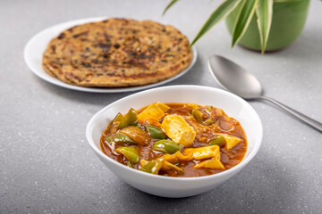 chilli paneer with lacha paratha served for the meal