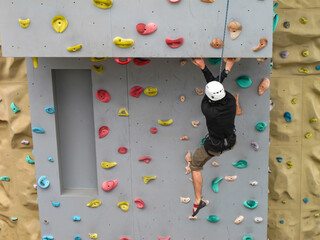 Rock climbing wall for free climbers onboard modern cruiseship or cruise ship liner for...