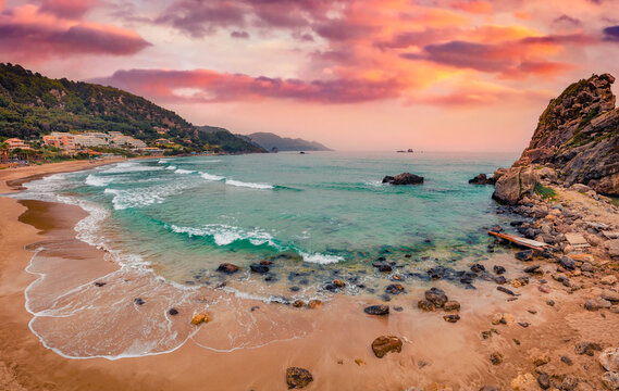 Beautiful marine scenery. Attractive spring sunset on Pelekas beach. Amazing evening seascape of Ionian Sea. Wonderful landscape of Corfu island, Kontogialos health resort, Greece, Europe.
