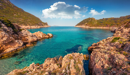 Beautiful marine scenery. Rocky summer scene of Pirates Bay, Porto Timoni, Afionas village...