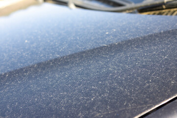 Image of a car body stained by yellow sand © shibadog