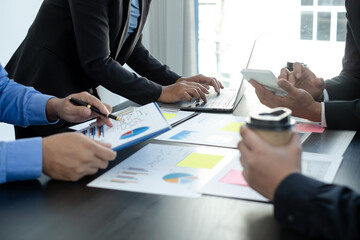 Meeting business team leaders about charts, financial graphs showing results are analyzing and calculating planning strategies, business success building processes
