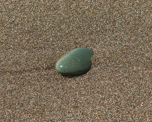 flat stone in the sand as background