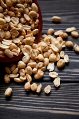 Nuts bowl on wooden background. Healthy vegan food.