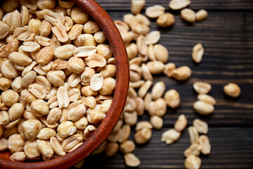 Nuts bowl on wooden background. Healthy vegan food.