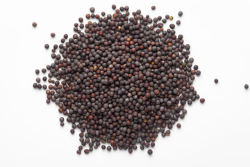 Macro close-up of Organic Black mustard seed (Brassica nigra)  on white background. Pile of Indian...