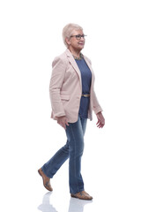 in full growth. confident senior woman goes forward