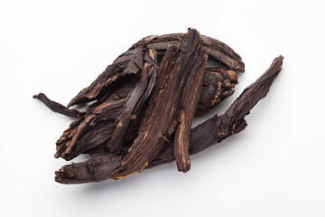 Macro close-up of Organic Alkanna tinctoria or ratanjot on white background. Pile of Indian Aromatic Spice. Top view