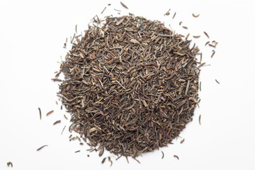 Macro close-up of Organic Black Cumin (Elwendia persica) or black caraway or Kala jeera on white background. Pile of Indian Aromatic Spice. Top view